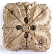 A carved oak and pierced roof boss, English, circa 1400 Of square-form, designed as a raised leafy-