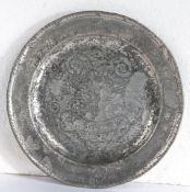 An early 18th century pewter single-reed and wrigglework plate, English, circa 1705-30 Designed with