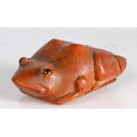 A charming and large coquilla gentleman's snuff box, circa 1800 Designed as a frog, set with glass
