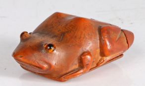 A charming and large coquilla gentleman's snuff box, circa 1800 Designed as a frog, set with glass