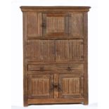 A small and interesting oak linenfold-carved cupboard  In the 16th century manner, having a deep