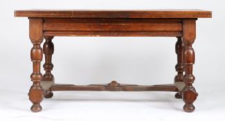 A walnut draw-leaf table, French, circa 1800 Having a fully-cleated twin-plank top, a draw-leaf to