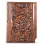 A 16th century oak Romayne-type panel, circa 1540 Designed as a male profile bust, wearing a