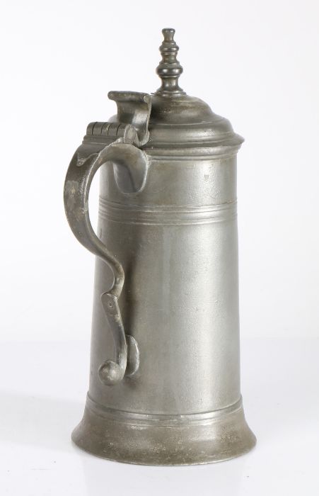 A small George I pewter spire flagon, circa 1720 OEWS quart capacity, the tapering drum with high