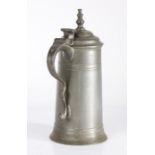 A small George I pewter spire flagon, circa 1720 OEWS quart capacity, the tapering drum with high