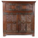 A large 16th century oak parchemin-carved cupboard, German, circa 1540 Having a central pair of