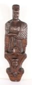 An unusual oak figural term, circa 1600 With elongated face, naked torso with one arm tucked in a