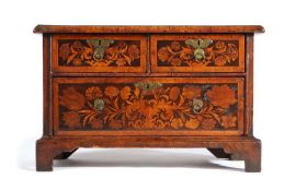 An attractive marquetry-inlaid table chest Parts late 17th century, the rectangular top above two