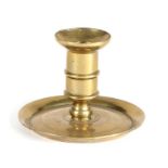 A good George I/II brass ‘lantern’ candlestick, circa 1720-40 The straight sided socket with mid-