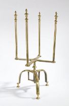 A rare George II brass revolving plate warmer and stand, circa 1750 Having four long finial-topped