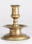 A mid-17th century brass socket candlestick, North-West European, circa 1640 The bold straight-sided