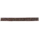 A Henry VIII carved oak long frieze rail, circa 1520 Designed with angular leaves, and fruits