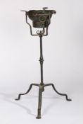 A rare wrought iron 'campaign' standing brazier, circa 1700 Having an iron ring inset with a pierced