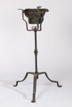 A rare wrought iron 'campaign' standing brazier, circa 1700 Having an iron ring inset with a pierced