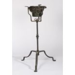 A rare wrought iron 'campaign' standing brazier, circa 1700 Having an iron ring inset with a pierced