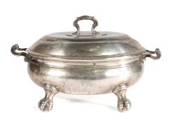 An early George III pewter lidded soup tureen, circa 1760 Of oval form, with some Rococo features