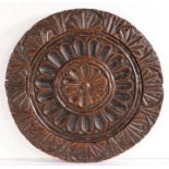 An 18th/19th century oak cheese print mould or cheese vat lid Of circular form, carved to the centre