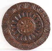 An 18th/19th century oak cheese print mould or cheese vat lid Of circular form, carved to the centre