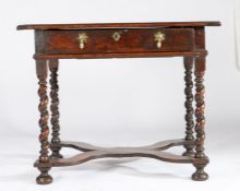A William & Mary oak side table, circa 1690 Having a triple-boarded and end-cleated top, and