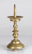 A 16th century brass pricket candlestick, German or Flemish, circa 1550 With flared drip tray,