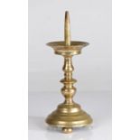 A 16th century brass pricket candlestick, German or Flemish, circa 1550 With flared drip tray,