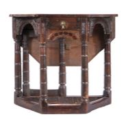 A James I oak games/credence-type table, West Country, circa 1620 The folding octagonal top above a
