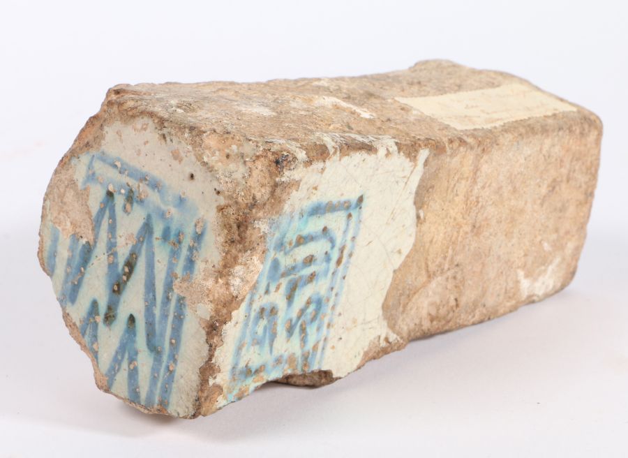 A partly glazed brick, Ayamonte, Spain Glazed to one end in blue with a dog tooth metic, flanked