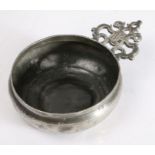 A Charles II pewter porringer, circa 1680 Having an old-English-ear, stamped with the ownership