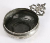 A Charles II pewter porringer, circa 1680 Having an old-English-ear, stamped with the ownership