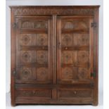 A Charles II oak livery cupboard, circa 1660 Having leafy-lunette interlaced carved top rails,