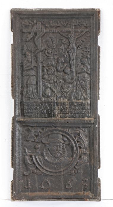 A 17th century cast iron fireback, dated 1663 Designed with Christ crucified next to the Brazen