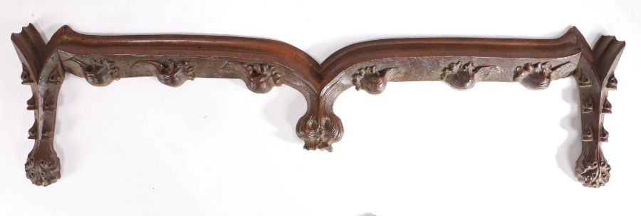 A walnut cresting/pediment, probably 15th century Of shallow ogee-arched form, each end designed