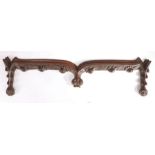 A walnut cresting/pediment, probably 15th century Of shallow ogee-arched form, each end designed