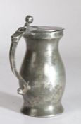 A pewter OEWS half-pint ball-and-bar baluster measure, English, circa 1700 The flat lid with two
