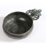 A late 17th century pewter porringer, English, circa 1685 Having a coronet ear with triangular