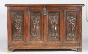 A mid-16th century oak coffer, French, circa 1550 Having an end-cleated triple-boarded lid, the