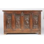 A mid-16th century oak coffer, French, circa 1550 Having an end-cleated triple-boarded lid, the