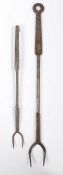 Two 18th century steel meat forks, English, circa 1750-80 The larger with two curved tines,