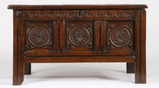 A small Charles II joined oak coffer, West Country, circa 1660 With triple-panelled lid, the front
