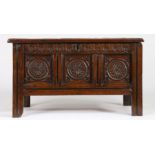 A small Charles II joined oak coffer, West Country, circa 1660 With triple-panelled lid, the front