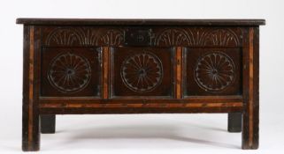 A Charles II oak and inlaid coffer, circa 1660 Having a triple panelled lid and front, each front