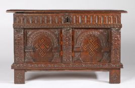 A good Elizabeth I oak and inlaid coffer, circa 1570 The boarded lid with reeded and ovolo-moulded