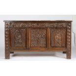 A Charles I oak coffer, West Country, circa 1640 Having a quadruple-panelled lid, the front with two