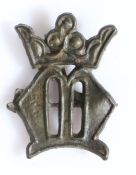 A 14th/15th century pewter pilgrims badge Designed with a crowned letter 'M', to represent Mary,
