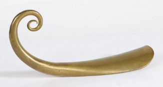 A George III brass shoehorn, circa 1790 With an extended hollow scrolled terminal, length 20.5cm