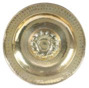 A large 16th century brass alms dish, Nuremberg, circa 1500-1550 The central boss of twelve double-