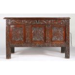 An interesting Charles I oak coffer, Lancashire/Cumbria, dated 1641 Having a triple-panelled