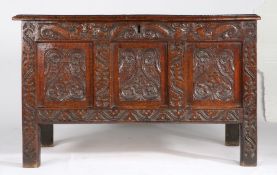 An interesting Charles I oak coffer, Lancashire/Cumbria, dated 1641 Having a triple-panelled