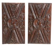 A pair of unusual mid-16th century oak Romayne-type panels One centred with a roundel enclosing a