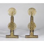A pair of 19th century brass and iron fire-dogs or andirons In the Charles II taste, and in the